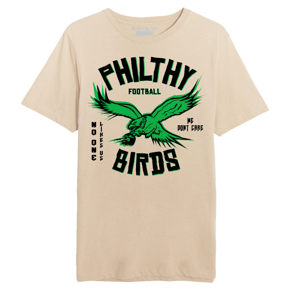 Philadelphia Eagles tee with eagles logo with skull in talons and text saying Philthy Birds No one likes us we dont care tan