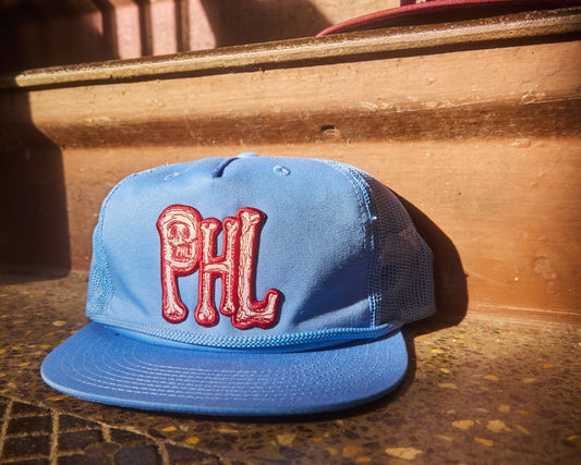 Light Blue Philadelphia Phillies snapback hat, surf style with maroon PHL logo made of bones, Embroidered patch design